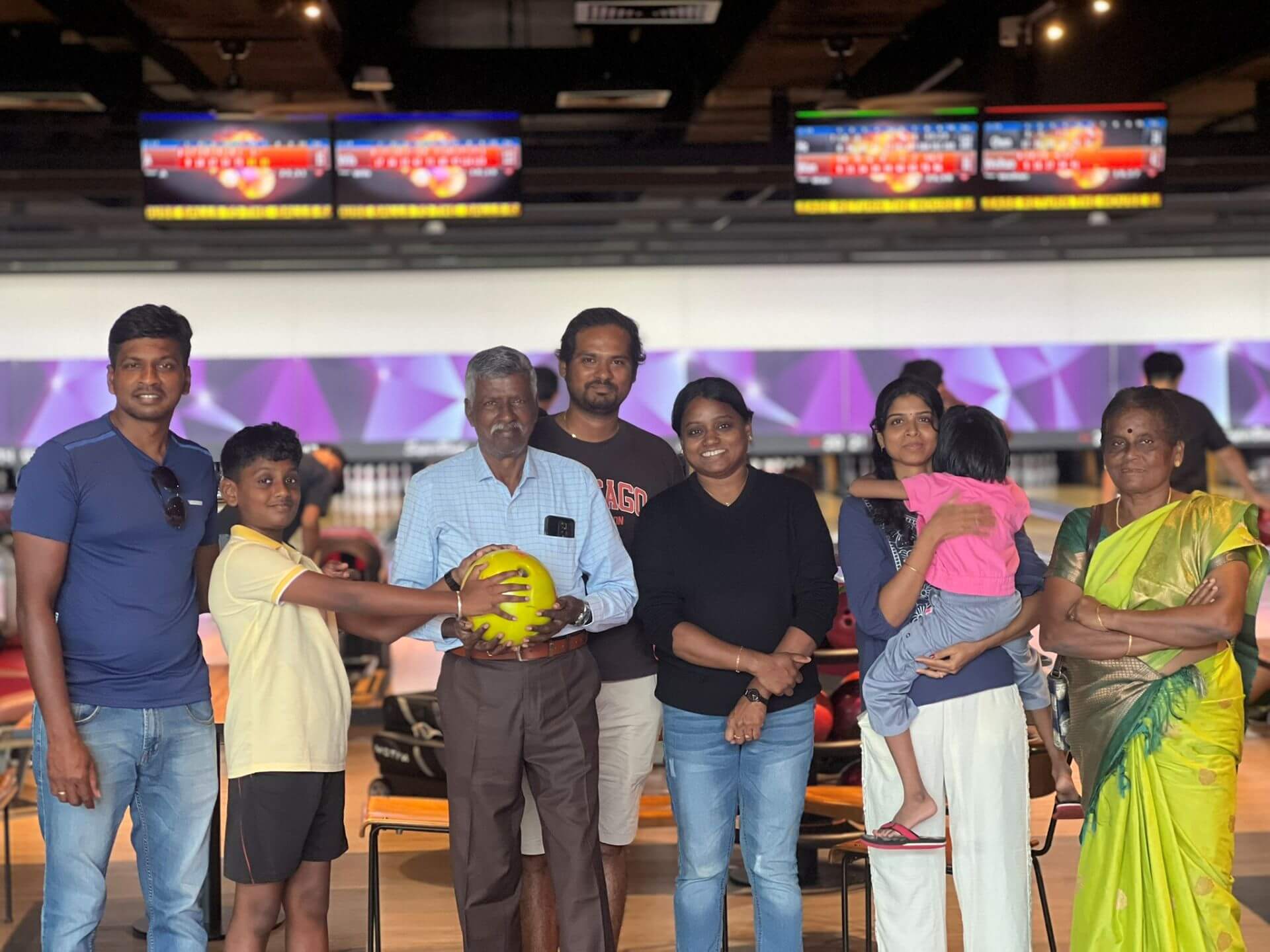 Family bowling fun in Singapore by Snap Friend SG